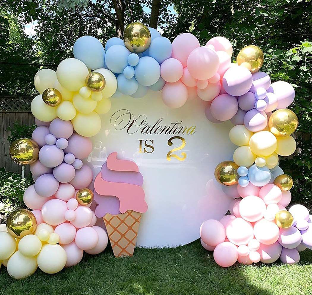pastel rainbow macaron balloon arch kit with ice cream cut out and birthday background