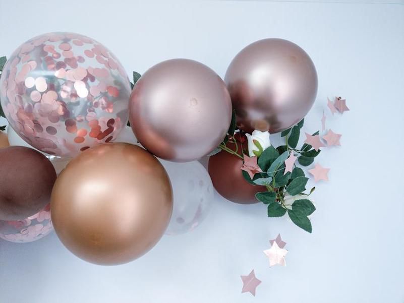 rose gold latex balloons with confetti balloons and leave display with stars pink