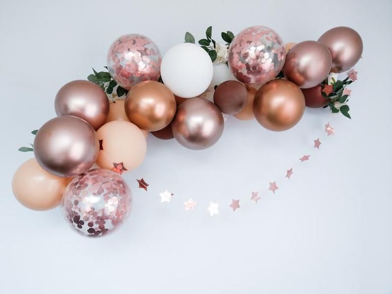 rose gold balloon arch kit display on white backdrop