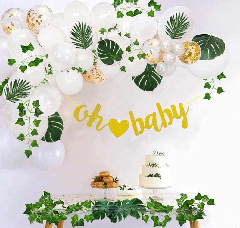 oh baby green white and gold balloon arch kit on white wall display with table setup