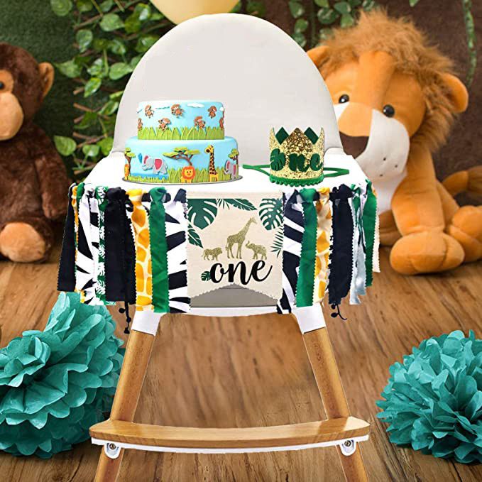 wild one first birthday banner kit with lion and monkey in the background